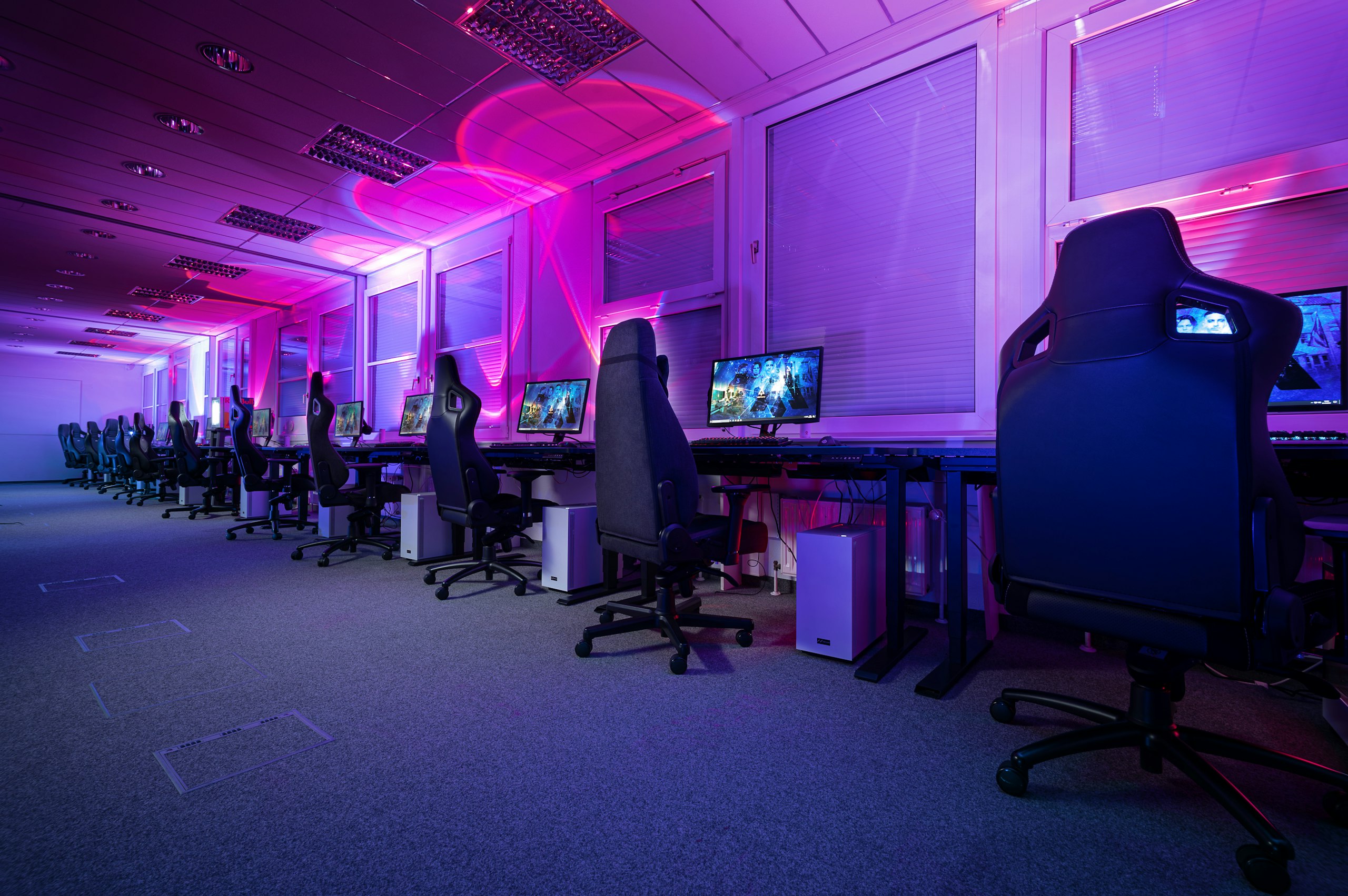 Team practice facility with rows of gaming stations